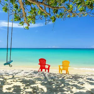 https://sand-and-tan-beach-hotel.comcaribbean.com